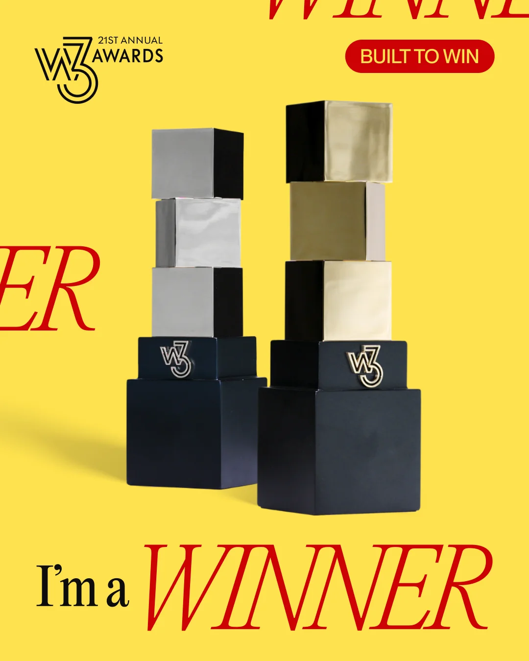 The gold and silver w3 Awards trophies on a yellow background with the words "I'm a Winner"